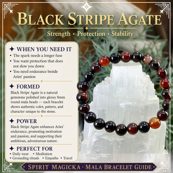 Black stripe agate bracelet of black, deep red and amber banded beads on a selenite tower