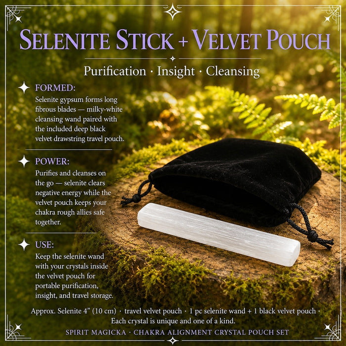 A white selenite wand lying in front of a black velvet drawstring pouch on a mossy wood round
