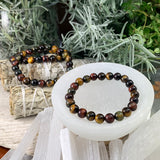 Mala Multicolor Tiger's Eye armband med sammetspåse